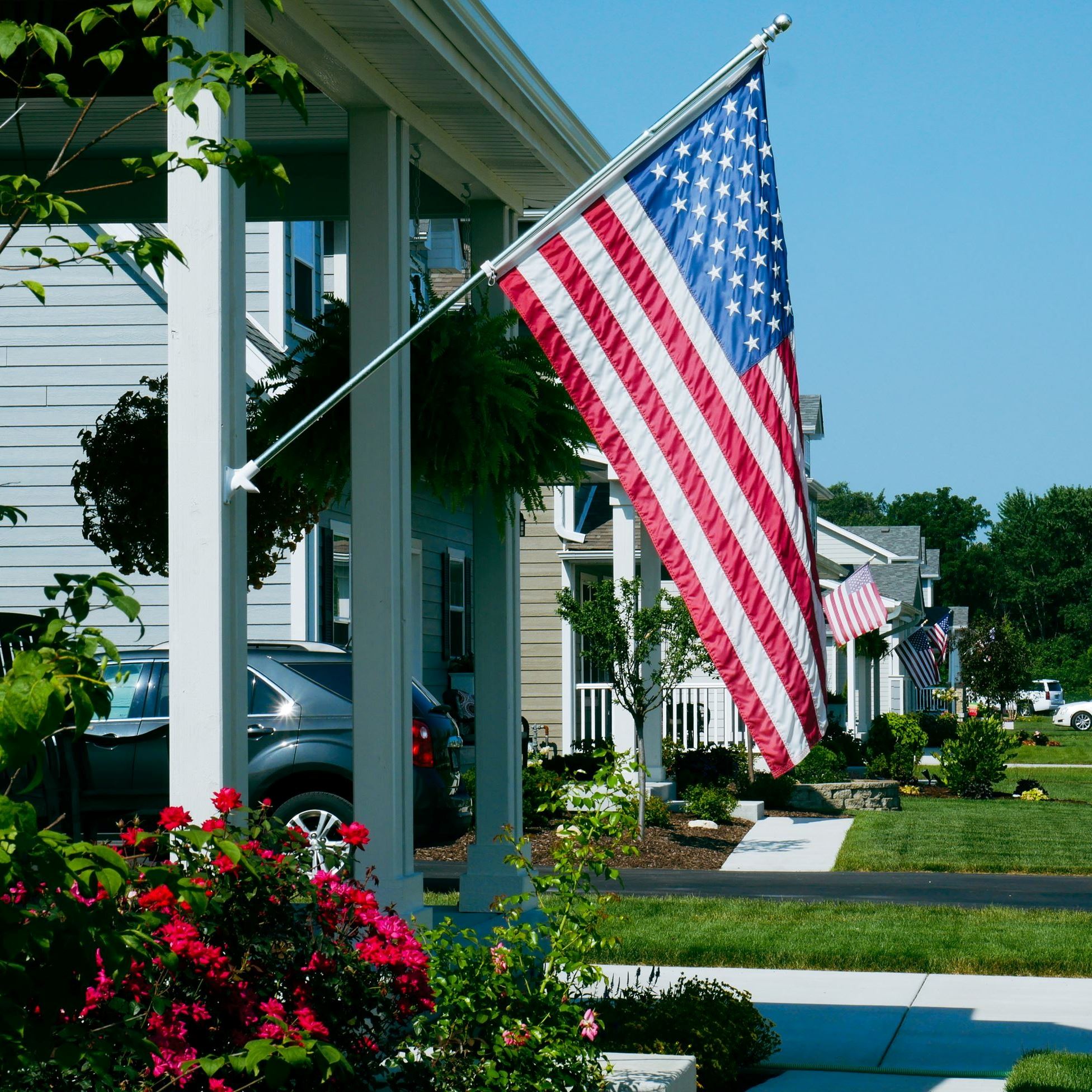 Village of home in Channahon Town Center with American flag